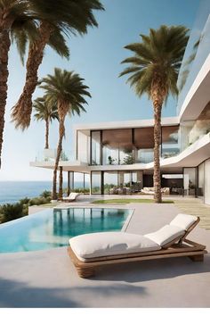 an outdoor swimming pool with chaise lounges and palm trees in front of it