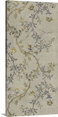 a beige and blue rug with flowers on it