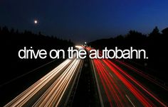 the words drive on the autobiann are lit up in front of a highway at night