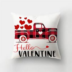 a red and black truck with hearts on the bed is featured in this pillow case