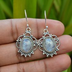 Rainbow Moonstone Earrings, Blue Fire Earrings, Natural Moonstone Earrings, Dangling Earrings, 925 Silver Earring, June Birthstone Jewelry. 》D E T A I L S《 ✦Stone: Natural Rainbow Moonstone ✦Shape: Oval ✦Size: 10x14 mm ✦Weight:- 7.55 Gram ✦SKU: SE-390 》A B O U T S T O N E《 💎 Moonstone is known to have many meanings and one of the overriding reasons for its use is for protection while travelling. ... Historically, moonstone has been said to possess feminine energies and can benefit fertility, love, protection and sleep. 》C U S T O M I Z E O R D E R《 We accept custom and personalized order. It can be change in the gemstone, earrings design and earrings size. Please send us message if you are interested in a custom creation. 》 P A C K A G I N G 《 Your jewelry will be nicely packaged. If one Nickel-free Moonstone Round Earrings, Nickel-free Moonstone Earrings For Gifts, Silver Crystal Earrings With Natural Stones, Round Shape, Silver Moonstone Pierced Earrings, Silver Round Crystal Earrings With Natural Stones, Silver Pierced Moonstone Earrings, Silver Moonstone Earrings For Anniversary, Silver Moonstone Gemstone Earrings, Handmade Silver Moonstone Crystal Earrings