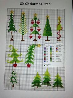 a cross stitch christmas tree pattern on a sheet of paper