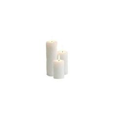 three white candles sitting next to each other