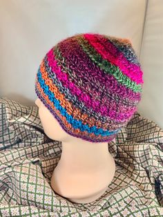 Look stunning in this beautifully hand crocheted adult sized beanie. Perfect for cold winters, autumn nights at the ball game, nights around the campfire. You'll receive many compliments while wearing these stunning colors. Warm Multicolor Crochet Hat One Size, Warm Multicolor One-size Crochet Hat, Colorful Yarn Crochet Hat, Colorful Crochet Yarn Hat, Multicolor Crochet Beanie Hat, Colorful Crochet Hat One Size Fits Most, Colorful Crochet Hat One Size, Multicolor Crochet Beanie For Fall, Multicolor Crochet Hat For Outdoor, Knitted