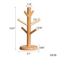 a wooden tree with three branches on it and measurements for the height of each branch