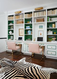 an advertisement for a home office with zebra print on the floor and green bookshelves