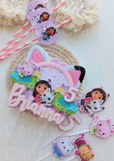 dora birthday party supplies including cake toppers and decorations