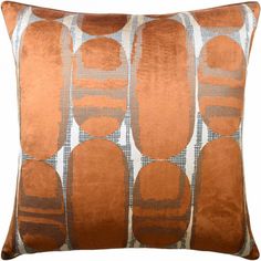 an orange and white pillow with circles on it