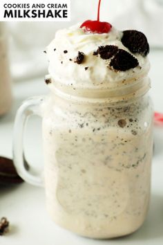 an ice cream sundae in a mason jar with a cherry on top and cookies and cream milkshake