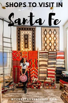 a woman standing in front of carpets and rugs with text overlay that reads shops to visit in santa fe