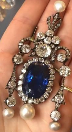 Antique blue sapphire 7.90 ctw. CZ zircon American Diamond 925 silver drop Brooch for women Metal: Sterling Silver Metal Purity: 925 Metal Wt: 13.100 Grams Stone Type: 100% Natural CZ Zircon Stone Color: white Diamond I-J Stone Clarity: AAA+ Stone Cut: Good Stone Shape: Round  Stone Wt: 7.90 Ctw Gemstone :Blue sapphire,pearl Gemstone wt: 3.4 ctw Dimension:  Length: 2.5 Inches Breadth:1.7 inches Product Color: Oxidized Black Rhodium on Diamond and Gold Rhodium on Sterling Silver 5 star service available  *Handmade item# *Free shipping worldwide# *Free engraving# *For other queries contact us any time # *Metal available: Sterling Silver Rose gold, yellow gold, white gold # *Service available 24/7# * Customisation available# * Our main focus to give 100% quality products to our buyers with sa Blue Diamond Brooches For Anniversary, Formal Sapphire Diamond Brooches, Elegant Sapphire Diamond Brooches, Formal Sapphire Diamond Brooch, Blue Diamond Gemstone Brooches, Elegant Sapphire Diamond Brooch, Elegant Silver Sapphire Brooches, Blue Sapphire Brooches As Gift, Blue Sapphire Brooches For Gift