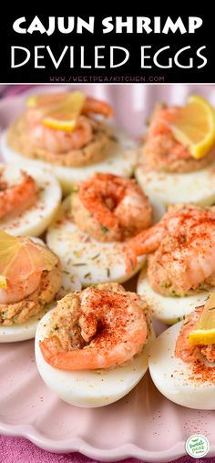 deviled eggs topped with shrimp and lemon on a pink platter, text overlay says cajun shrimp deviled eggs