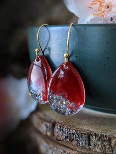 Red colored  teardrop hook gold stainless steel earrings. This item is: 1 pair of red and teardrop shaped hook earrings. They are hand crafted teardrop shaped hook earrings, filled with red and clear gemstones and resin. These would make a wonderful gift for your favorite person. I can create custom pieces in this style to your taste. Please contact me with your ideas. All of my store items are hand crafted with care in the United States of America. The earrings will be carefully packaged for sh Clear Gemstones, Earrings Prom, Prom Earrings, Teardrop Dangle Earrings, Steel Earrings, Earrings Red, Red Earrings, Resin Earrings, Stainless Steel Earrings