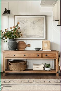 a wooden table with two baskets on top of it next to a wall mounted map