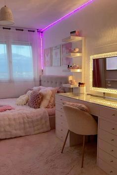 a bedroom with a bed, desk and mirror