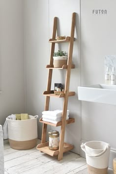 a bathroom with a ladder shelf next to a sink