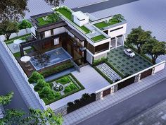 an aerial view of a house with green roofing and landscaping on the top floor