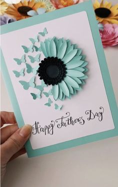 a greeting card with a flower and butterflies on the front that says, happy father's day