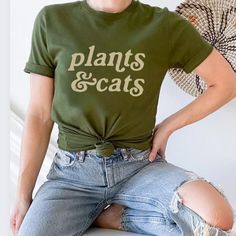 Cats And Plants Shirt, Plant Shirt, Gardener T-Shirt, Gift For Plant Lover, Cat Lover Shirt, Retro Plants Shirt, Plant Lady, Plant Mom Discover The Purr-Fect Blend Of Your Two Favorite Things With Our Cats & Plants Unisex T-Shirt! This Trendy And Comfortable Tee Is A Must-Have For Any Cat Lover And Plant Enthusiast. Made With High-Quality, Soft Bella Canvas, It Features A Charming Graphic That Creatively Combines Adorable Cats With Lush Green Plants. Available In A Variety Of Sizes And Popular C Plant Lady Outfit, Plant Tshirt Design, Plant Clothes, Plants And Cats, Plant Shirts, Cats Plants, Gardening Shirts Funny, Cute Tshirt Designs, Gift For Plant Lover