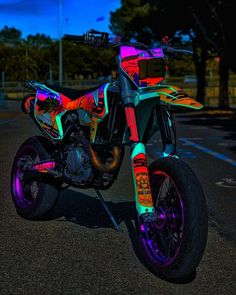 a colorful motorcycle is parked on the street