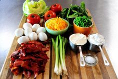 a cutting board topped with different types of food