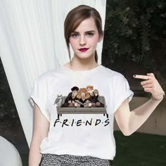 a young woman is posing with her friends t - shirt