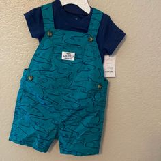 Carter’s Shark Overalls. Two Piece Set. Dark Blue Onsie Underneath. Summer Blue Sets With Pockets, Cute Blue Cotton Set, Cute Blue Tops With Pockets, Blue Summer Sets With Pockets, Casual Light Blue Sets For Playtime, Blue Summer Set With Pockets, Light Blue Casual Sets For Playtime, Summer Playtime Sets With Pockets, Casual Light Blue Playtime Set