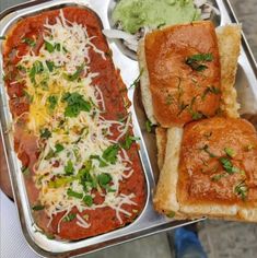 two trays filled with different types of food