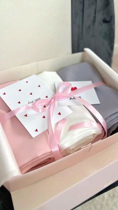 a pink box with some cards in it