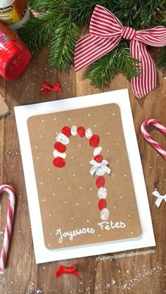 a homemade christmas card with candy canes and candies