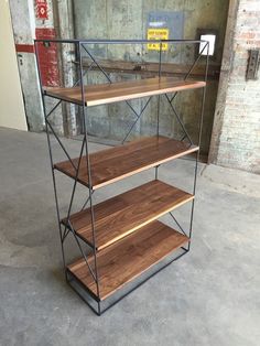 three tiered shelving unit with wooden shelves