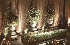 an elegant wedding setup with flowers and greenery