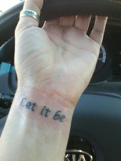 a person's arm with the words eat it be written on it in black ink