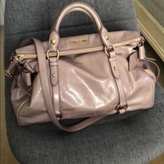 Carefully Used, Authentic Miu Miu Purse Purchased In 2014. Comes With Dust Bag!. Has Been In Storage With Tissue Paper So It Doesn’t Lose Its Shape. Has Been Sitting In The Closet For So Long, Would Love To Find It A New Home. Some Signs Of Wear, Most On The Bottom Of The Bag (Pictured). White Spot In The Side Of The Bag That Might Be Easily Removed (Haven’t Tried). Offers Welcome. Miu Miu Shopping Bag With Removable Pouch, Designer Miu Miu Shopping Bags, Miu Miu Shoulder Bag With Removable Pouch, Luxury Miu Miu Shoulder Bag For Shopping, Miu Miu Crossbody Shoulder Bag For Shopping, Miu Miu Purse, Miu Miu Bag, In The Closet, Balenciaga City Bag