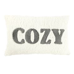 a white pillow with the word cozy printed in black on it's front and back