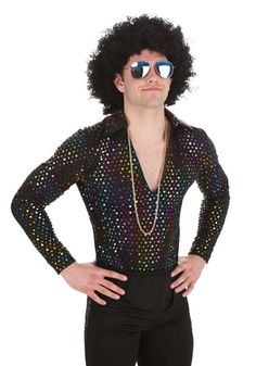 a man with an afro wig and sunglasses on his head wearing black pants, a shirt that has multicolored spots