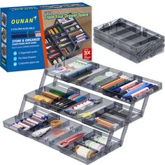 two clear drawers with different types of paint and pencils in them on top of each other