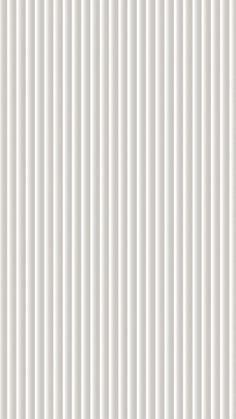 a white wall with vertical lines on it