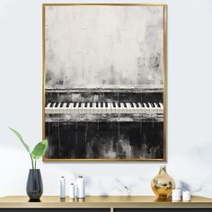 a black and white painting on the wall above a piano