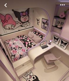 a bedroom with hello kitty decorations on the walls and bed in the corner, along with a desk