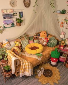 a bed with lots of stuffed animals on top of it in a room filled with plants