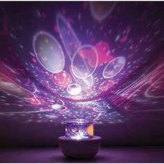 an image of a colorful light show coming from a bowl on the floor with lights in it