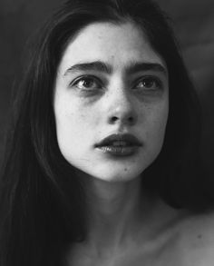 a black and white photo of a woman's face