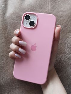 a woman's hand holding an iphone case with her finger on the back of it