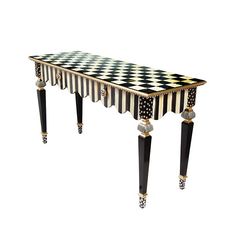 a black and white checkered table with gold trimmings on the legs is shown