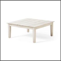 a white wooden table sitting on top of a white floor