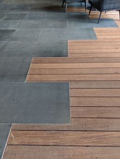 two chairs sitting on top of a wooden floor