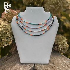 Step into a world of rustic elegance with our Western Seed Bead Choker Necklace. Designed to capture the essence of Western style with a contemporary touch, this choker is a stunning accessory that adds a distinctive flair to any outfit. With its intricate beadwork and adjustable fit, it's perfect for anyone who appreciates unique, handcrafted jewelry. Featuring a detailed seed bead design, this choker showcases a blend of rich textures and colors inspired by Western aesthetics. The 15-inch leng Rustic Adjustable Beaded Necklace, Rustic Multicolor Beaded Jewelry, Long Beaded Necklace Western, Seed Bead Necklace Ideas Western, Western Beaded Jewelry, Seed Bead Western Necklace, Western Seed Bead Necklace, Western Glass Bead Necklace, Seed Bead Necklace Patterns