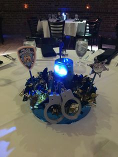 a police themed centerpiece with handcuffs and lights