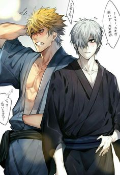 two men in kimonos standing next to each other